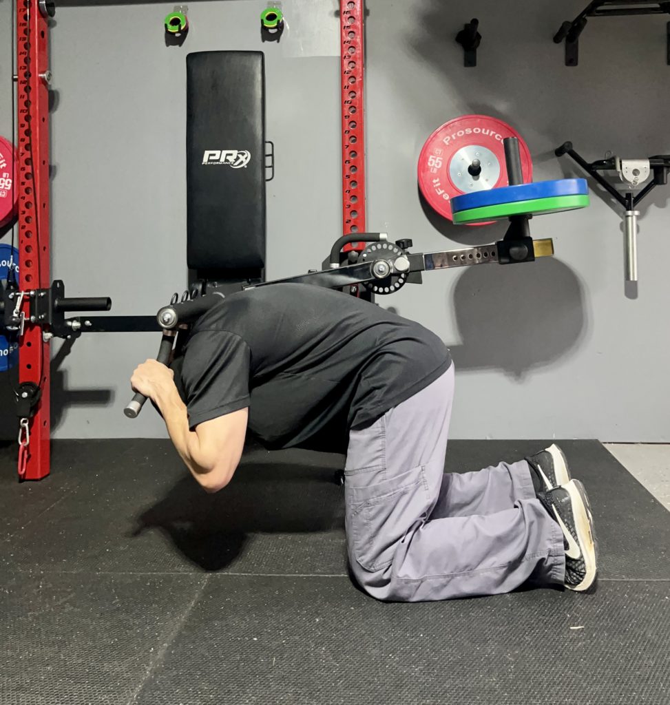 Weighted crunches on the Bulletproof Fitness Isolator