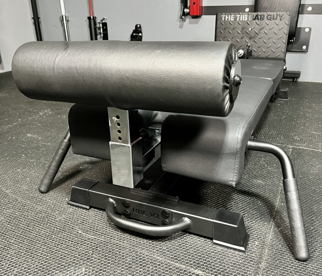 split squats and hip thrusts on the tib bar guy nordic back extension machine v2