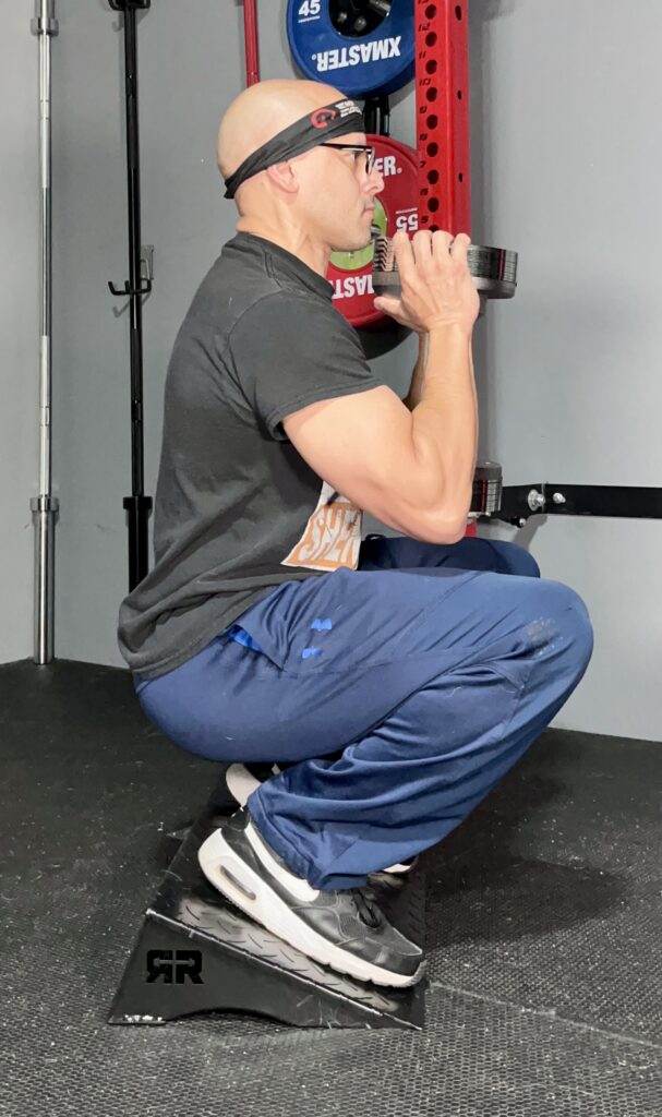 heel elevated squats on the ripped ramp