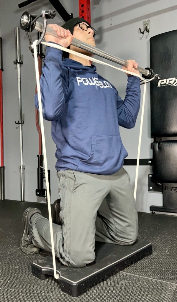 shoulder press exercise on the harambe system