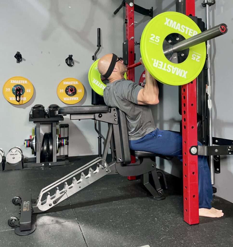 seated military press on the edge infinity bench