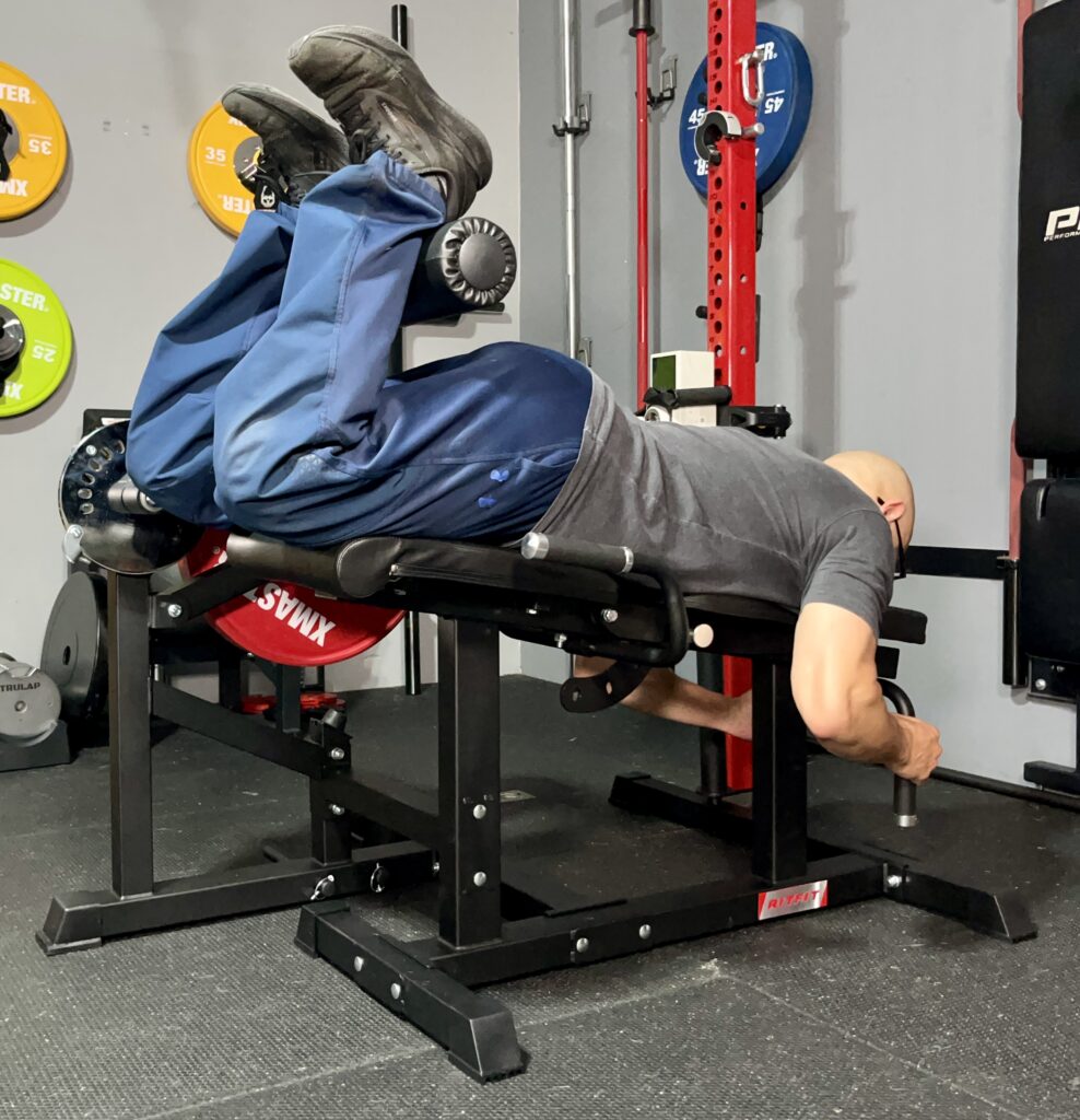 leg curls on the ritfit leg extension curl machine
