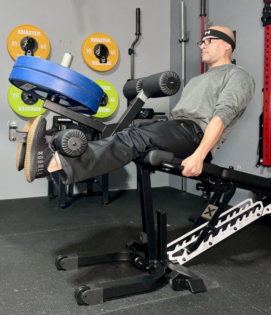 doing leg extensions on the freak athlete abx